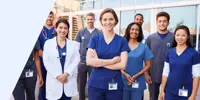 A team of healthcare professionals wearing scrubs